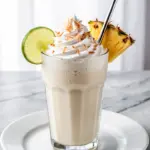 creamy coconut pina colada mocktail - featured image